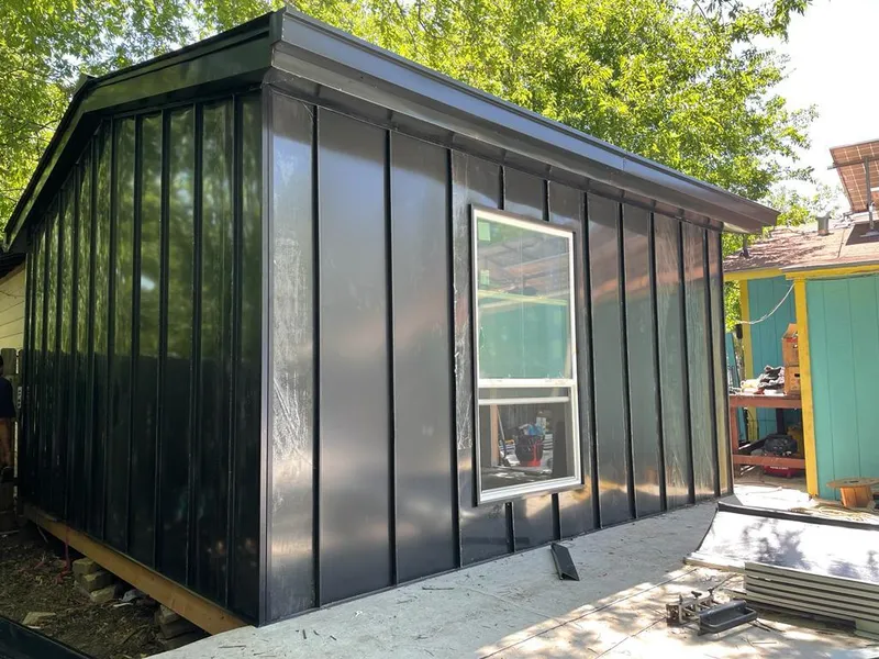 Black standing seam metal wall panels for Roof Inspection in Geneseo