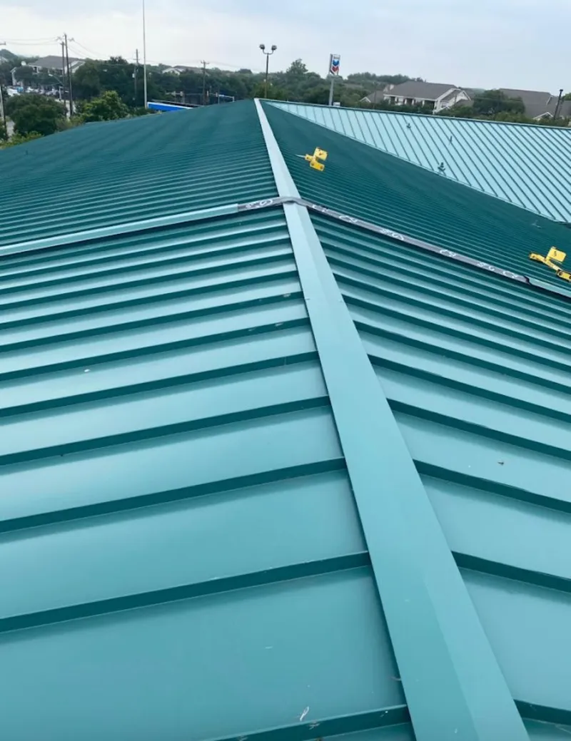 Green commercial metal roof ridge and valley for Metal Roof Repair in Geneseo